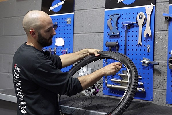 Install other side of tyre into your bike rim