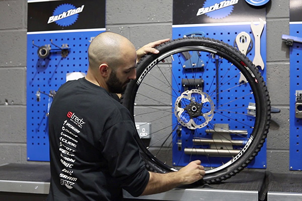 Rotating bike wheel to help tyre sealant set