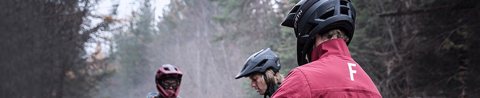 Rear view image of a Mtb'er in a helmet