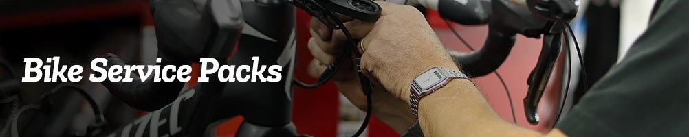 A Tredz mechanic tightens bolts on a road bike's stem