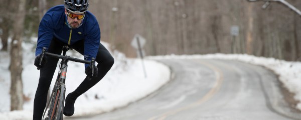 Road cyclist on snow conditions