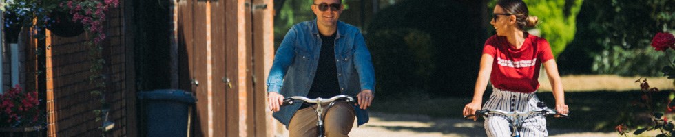 Man and woman cycling together