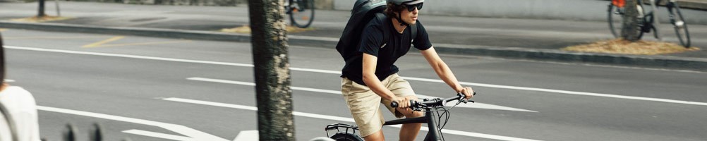 A commuter cycling through the city