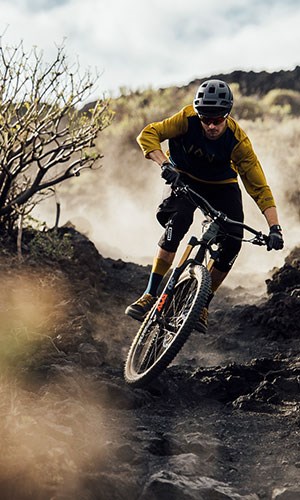 A mountain biker wearing ION Scrub clothing