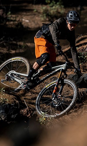 A mountain biker wearing ION Traze clothing