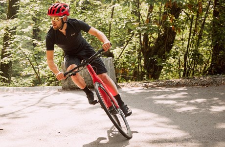 Cyclist taking a corner on a BMC Alpenchallenge