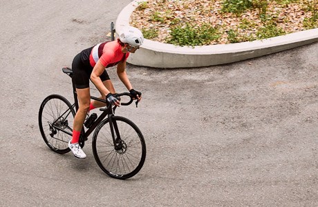 A road cyclist going around a hairpin bend on the BMC Teammachine