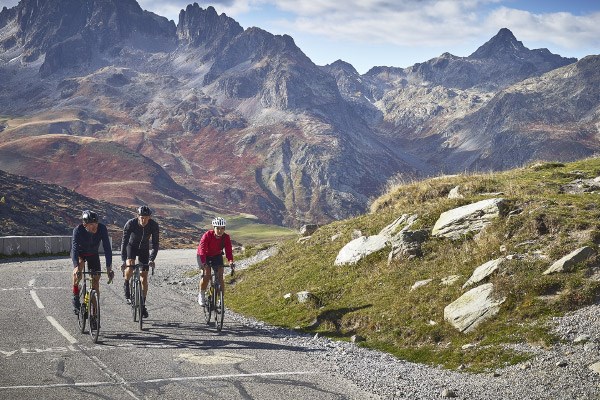 A group of cyclists ascending a French mountain road using Mavic components and apparel