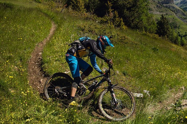 Enduro mountain bike rider on single track trail