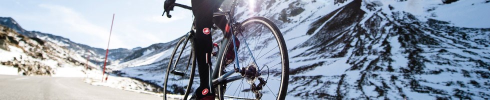 A cyclist in bib shorts in a cold winter scence