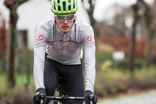 Road cyclist wearing a winter jersey