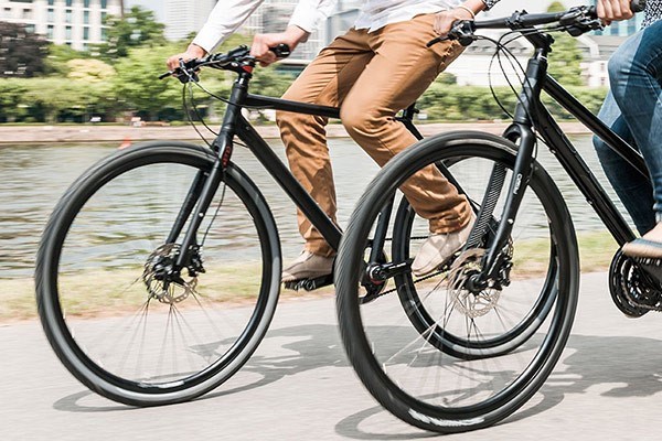 Two hybrid bikes on a canal towpath