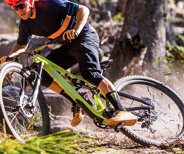 Mountain biker descending a trail