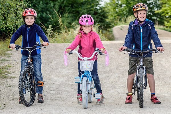 Kids on various size bikes