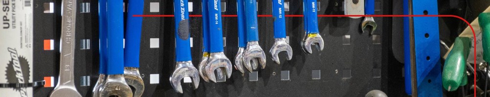 A mountain biker riding a hardtail down a trail