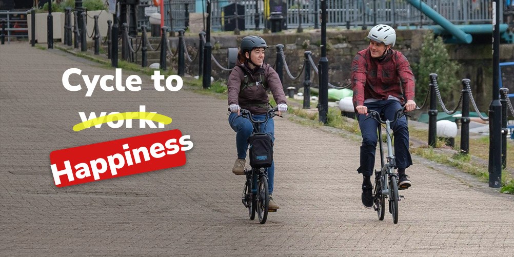 Riding an urban e-bike in a street with redd brick houses