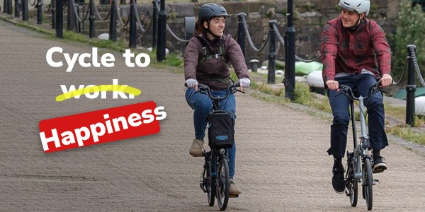 Riding an urban e-bike in a street with redd brick houses