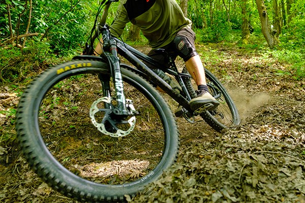 hardtail MTB cornering in dirt