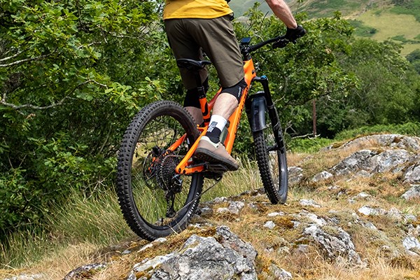 MTB rider on stones riding a speciliazed levo SL