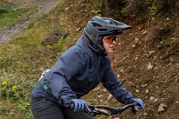 female rider wearing a 3/4 MTB helmet
