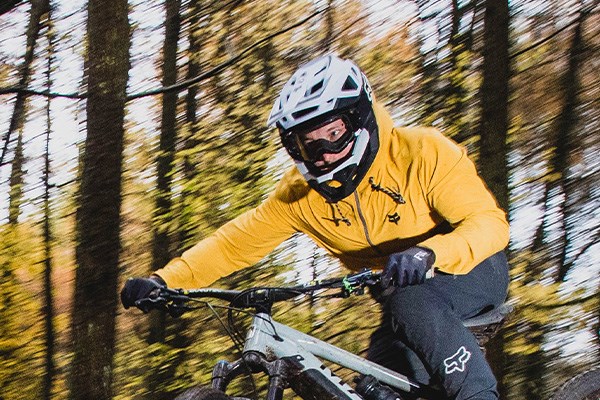 Rider wearing a full face MTB helmet