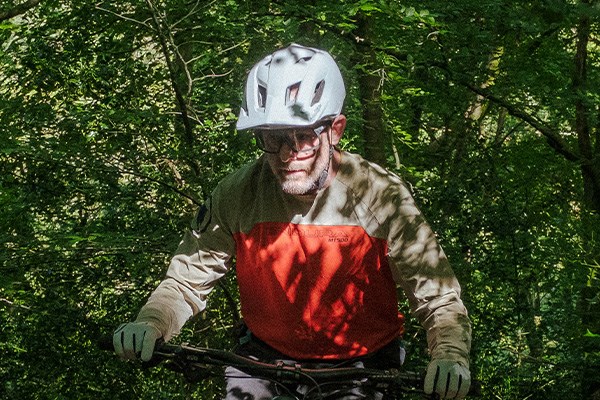 MTB helmet with a visor shading eyes from the sun