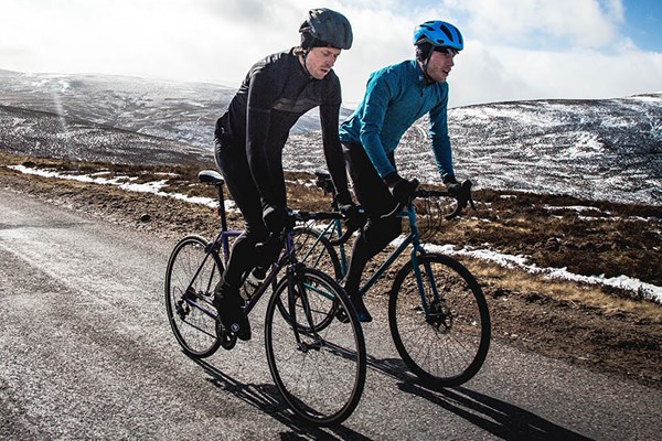 two road cyclists in winter