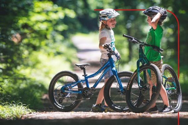 Two children riding bikes