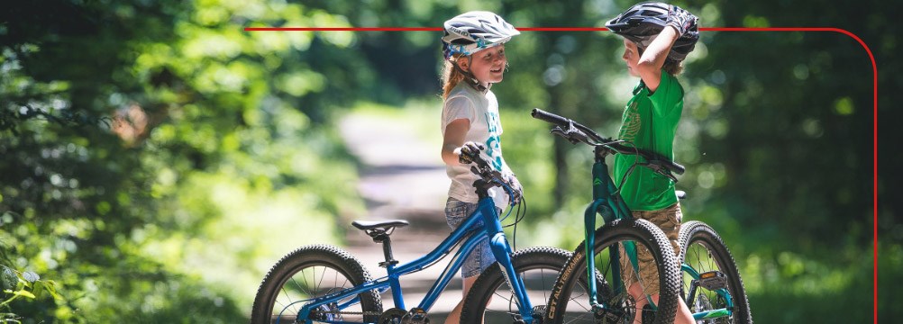 Two children riding bikes