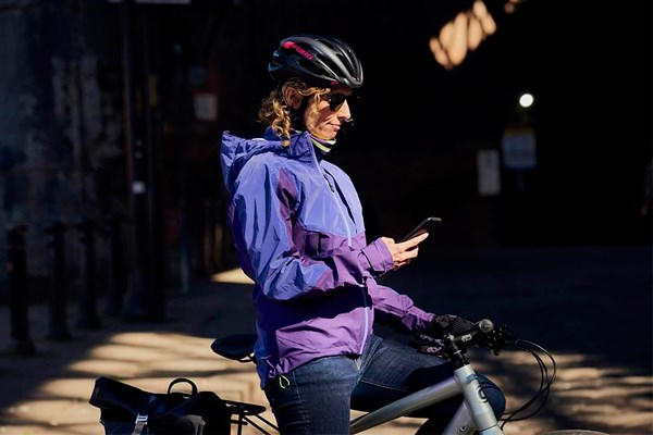 Cyclist checking phone