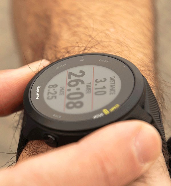 Garmin Forerunner 55 watch face showing distance, time and pace