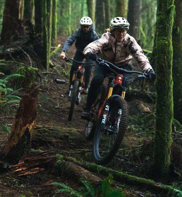 Two MTB riders descending on  Levos