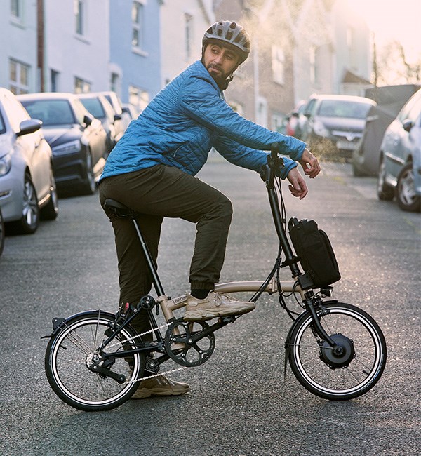 Man sitting on a Brompton Electric C Line Explore 12-speed