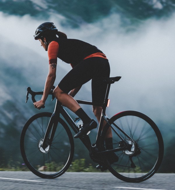 woman cyclist riding orbea orca