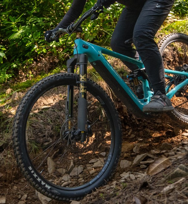 Fox Podium Fork on a Yeti ebike being ridden down a rough trail