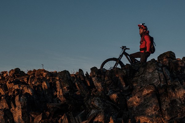 MTB night riding in the mountains around large rocks