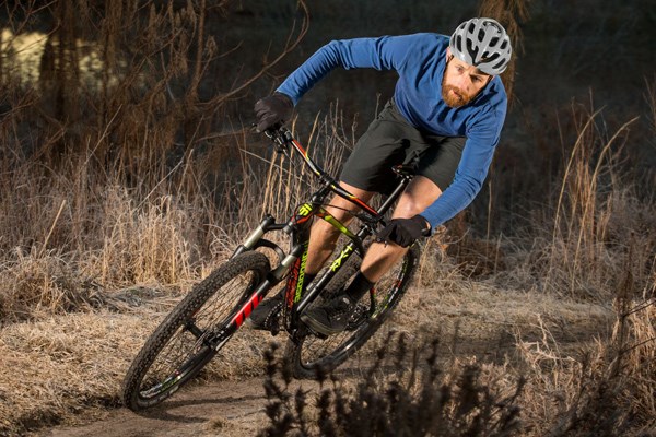 riding a hardtail MTB on single track trail