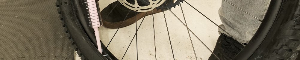 Adding sealant to a tubeless mountain bike tyre