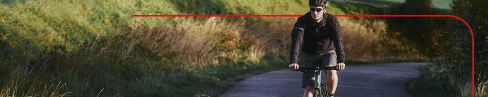 Hybrid cyclist riding in rural area