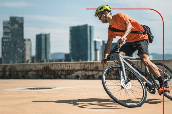 A cycle commuter riding through the city