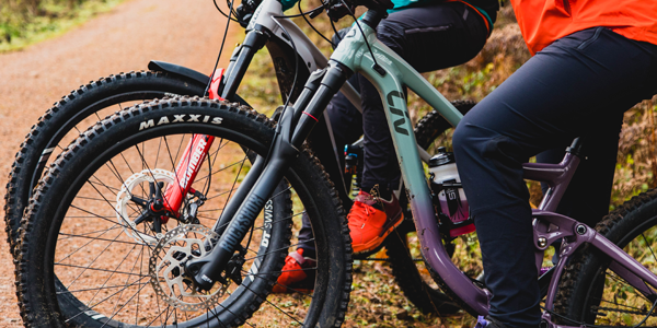 A mountain biker wearing waterproof trousers