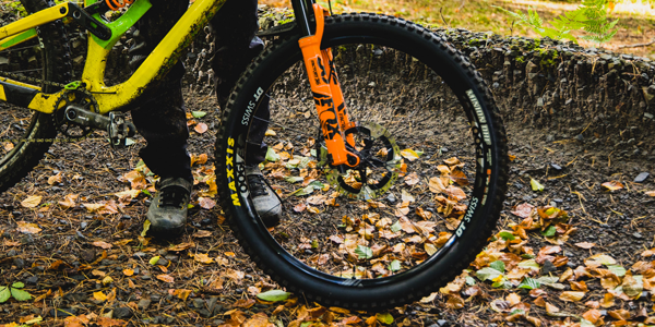 A commuter riding a Specialized flat bar road bike with tyres suitable for wet weather