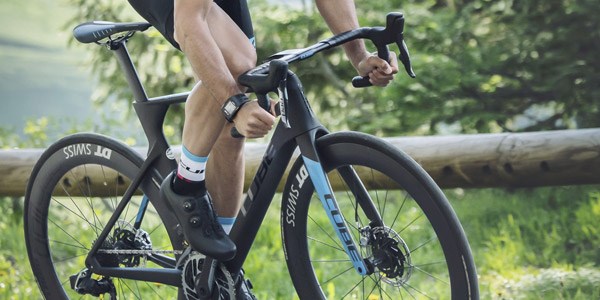 A road cyclist riding on lightweight aero wheels