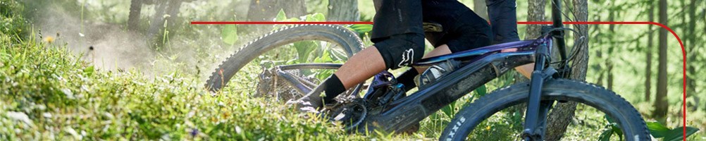 Mountain biker riding an E-MTB