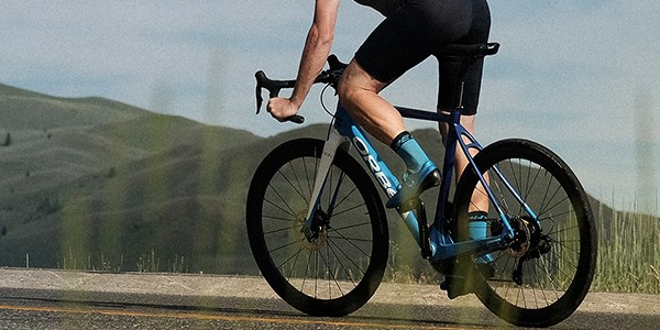 A road cylist riding an electric road bike.