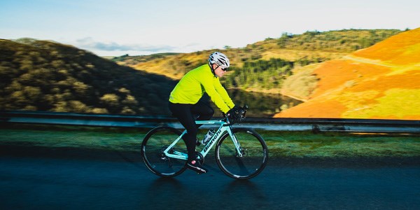 A road cylist riding an electric road bike.