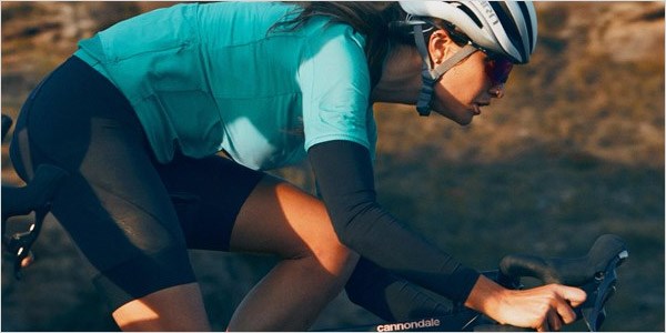A cyclist riding over rough terrain on the Topstone Carbon 2020