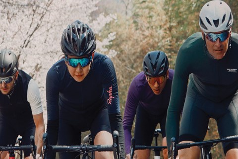 4 people road cycling