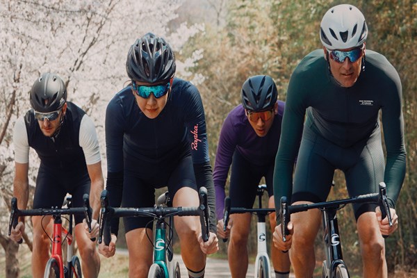 four cyclists riding road bikes